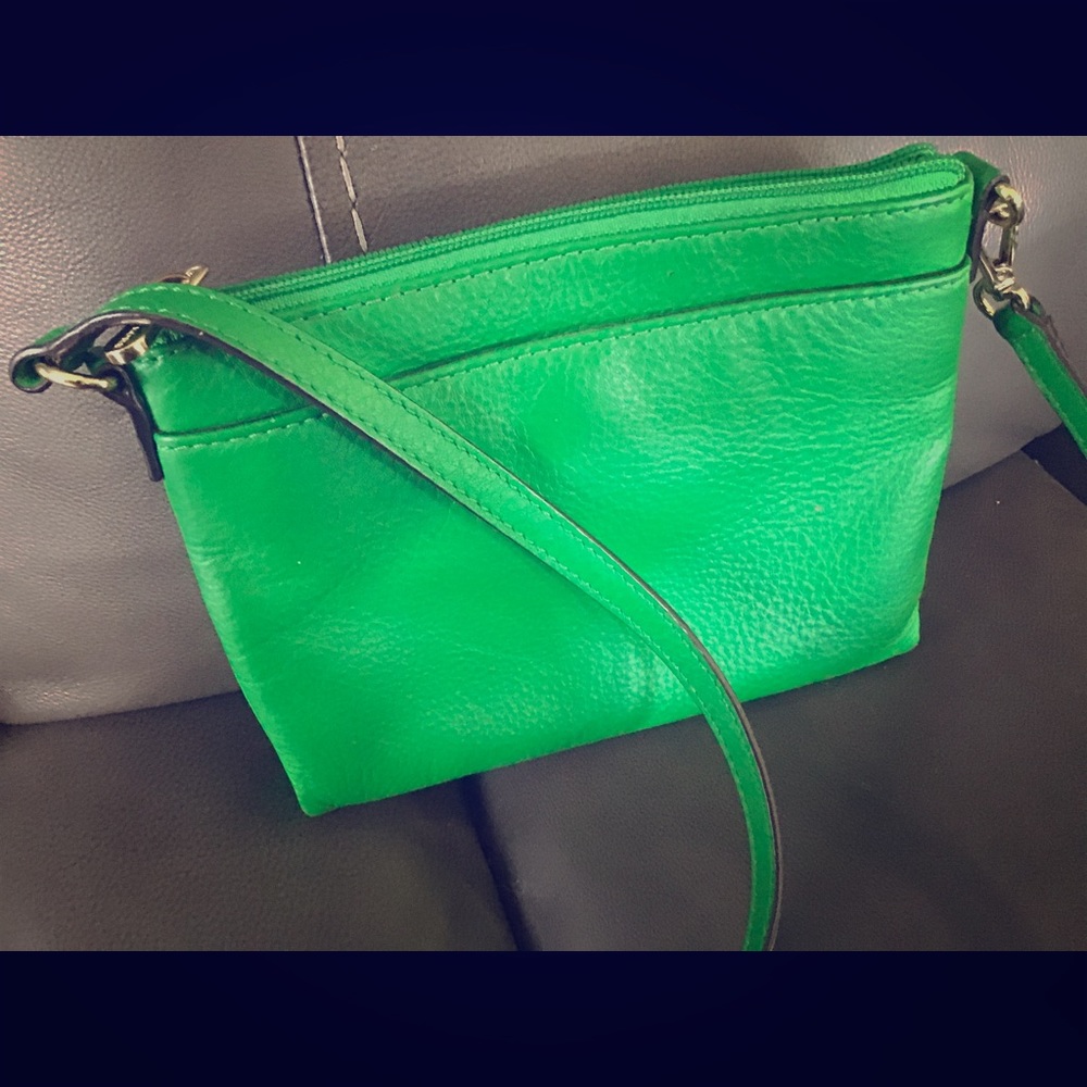 MK Kores wallet on a string